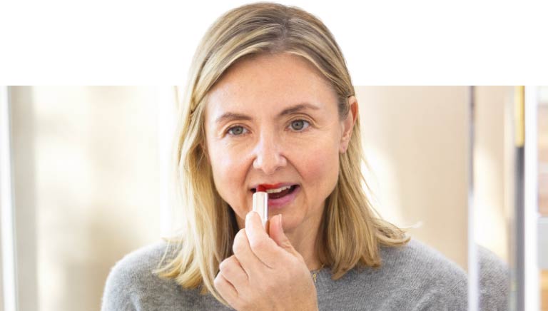 Actor Portrayal of Woman Applying Lipstick Actor portrayal applying makeup